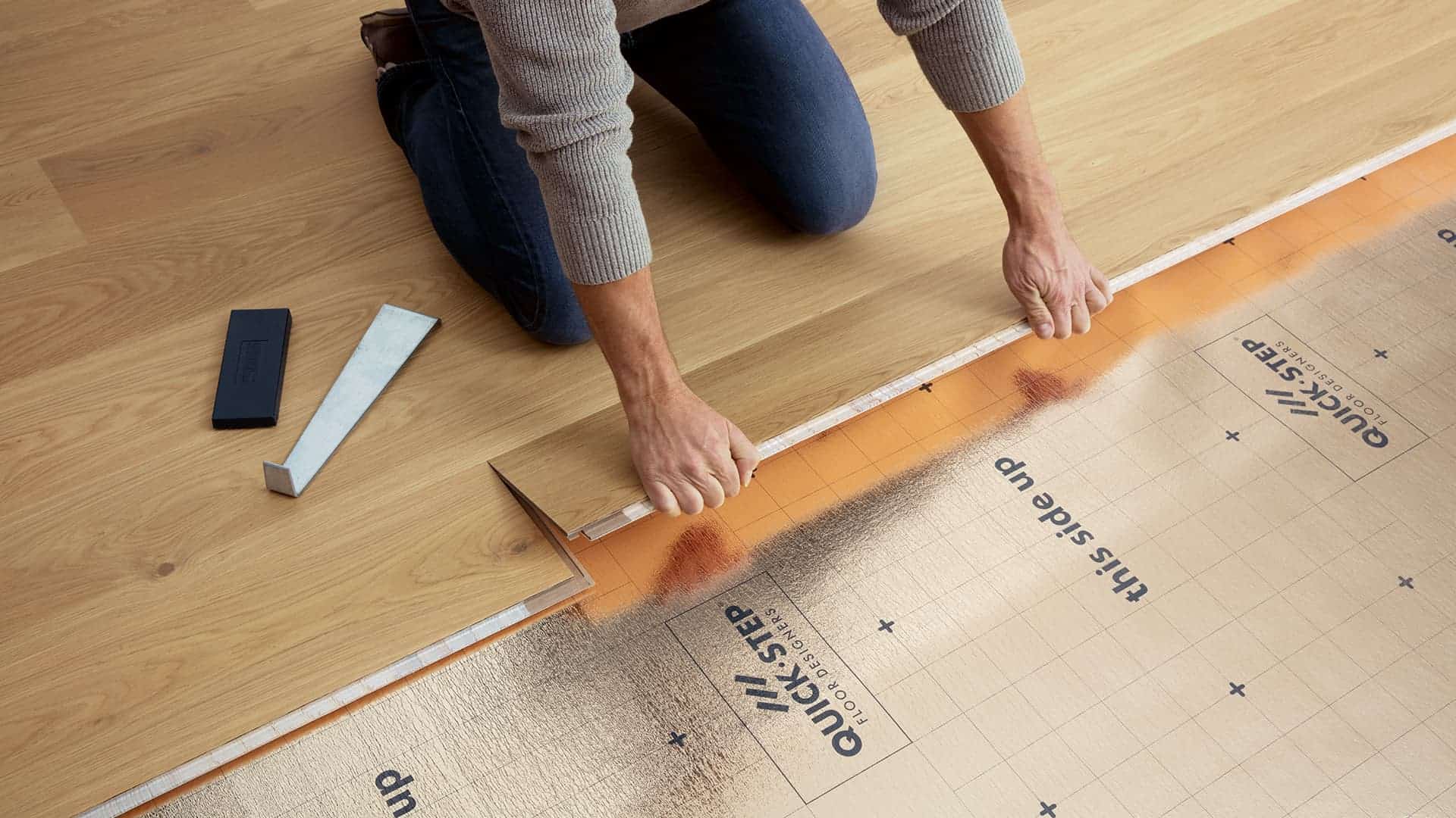 Professional installers working on a floor